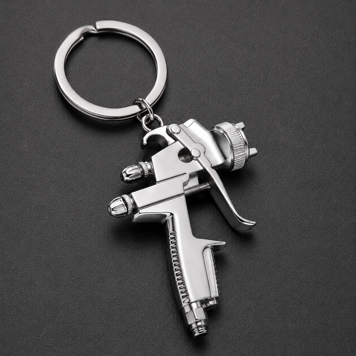 Mini chrome spray gun keyring with detailed nozzle and trigger