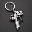 Mini chrome spray gun keyring with detailed nozzle and trigger