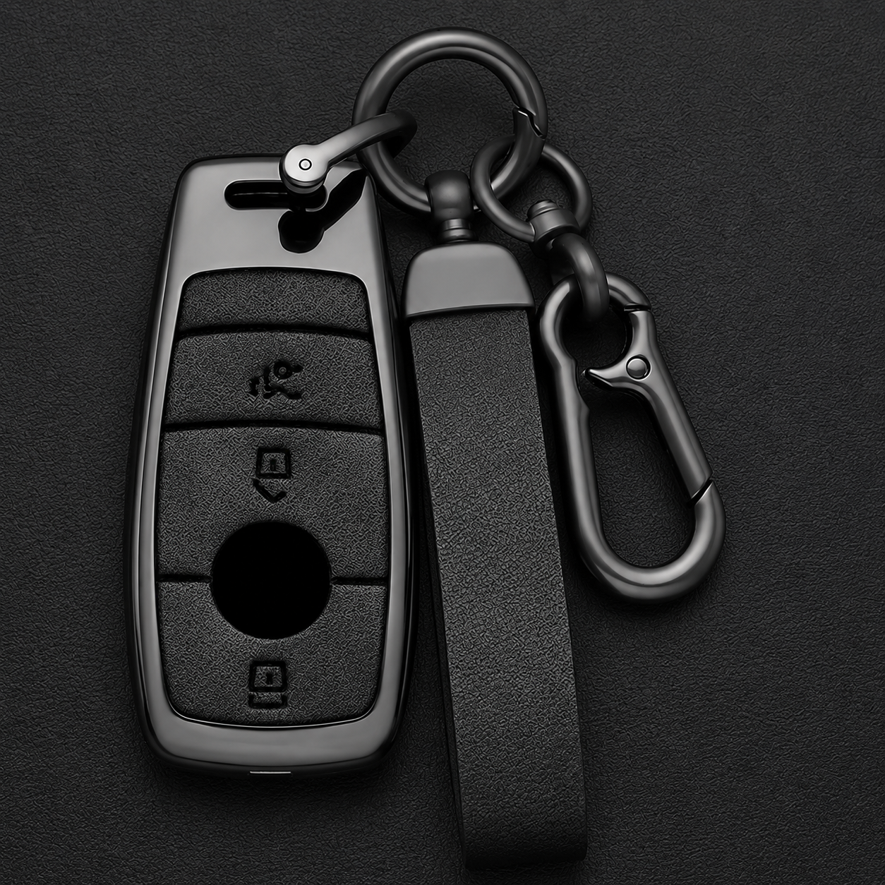 Mercedes-Benz gunmetal zinc alloy key cover and leather carabiner keychain set on dark background